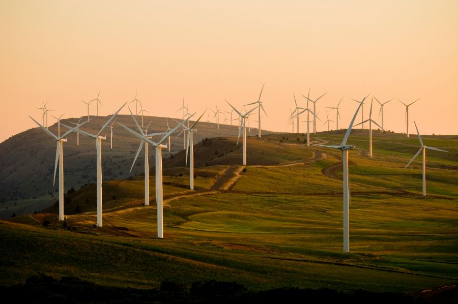 Infrastructure and energy transition: wind turbines at sunset